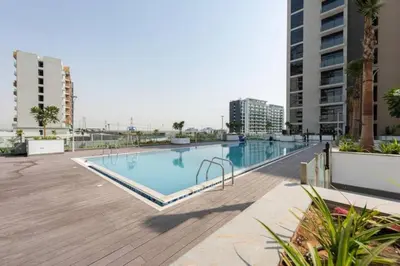 an empty swimming pool in the middle of a building at Locations l Luxurious Studio l Free Pool, Gym Access l Meydan in Dubai