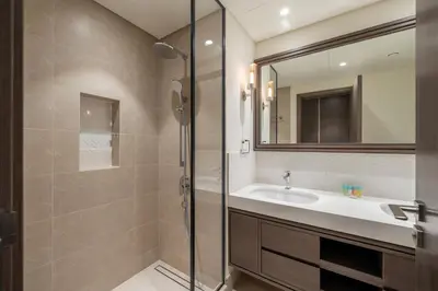 a bathroom with a sink and a shower at Beach access 2BR with Balcony & Sea View in Dubai