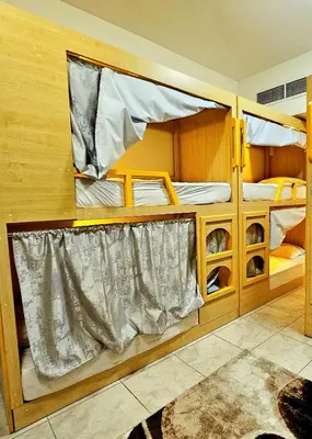 two bunk beds in a small room with a rug at Come experience Dubai Marina with luxury capsule in Dubai