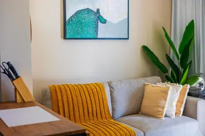 a living room with a couch and a table at 1Bedroom Canal View near Dubai Mall-Business Bay in Dubai