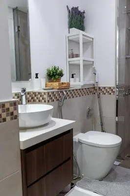 a bathroom with a toilet and a sink at 1Bedroom Canal View near Dubai Mall-Business Bay in Dubai