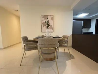 a dining room with a table and chairs at Duja Tower 4114 in Dubai