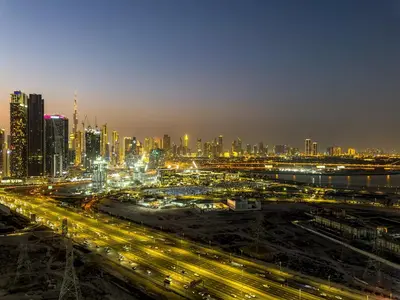 a view of a city at night with traffic at PVH - Stunning 2BR - Creek Vistas Grande in Dubai