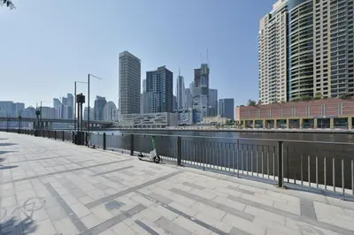 a city skyline with tall buildings and a body of water at Modern 1BR I Canal View I Business Bay Dubai in Dubai