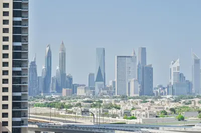 a view of a city skyline with tall buildings at Modern 1BR I Canal View I Business Bay Dubai in Dubai