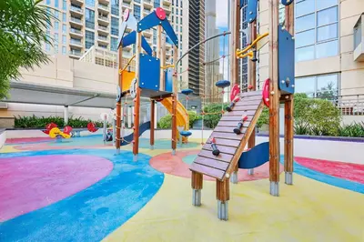 a childrens playground with a slide and slides at FIRST CLASS 1BR Burj Khalifa View , Near Metro in Dubai