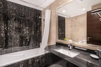 a bathroom with a sink and a mirror at Studio in downtown of Dubai in Dubai