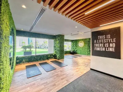 a room with plants and a sign on the wall at Studio in downtown of Dubai in Dubai