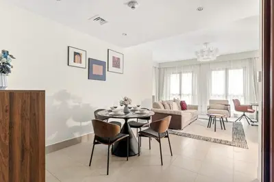 a living room with a table and a couch at FIRST CLASS 1BR Cozy Old Town Escape in Dubai