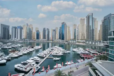 a group of boats docked in a harbor in a city at Spacious 2 Bedroom plus Office Prime Dubai Marina in Dubai
