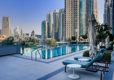 a swimming pool with a view of a city at Iconic Burj Khalifa & Fountain Views near Dubai Mall in Dubai