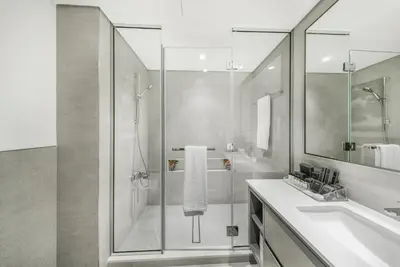 a bathroom with a shower and a sink at Iconic Burj Khalifa & Fountain Views near Dubai Mall in Dubai