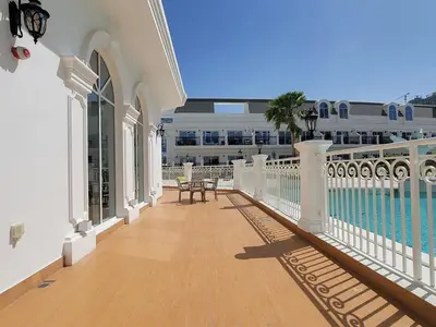 a balcony of a building with a table and a bench at Miracle Luxury Studio in Dubai