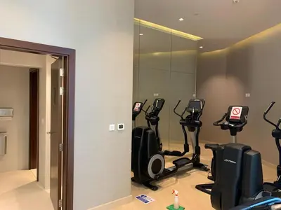 a room with a bunch of exercise bikes in it at Mahenti · Luxury Living at Its Finest in Dubai