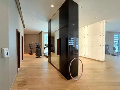 a room with a mirror and a large glass wall at Mahenti · Luxury Living at Its Finest in Dubai
