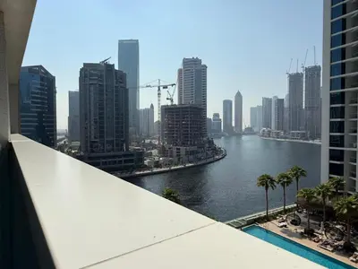 a view of a river in a city with tall buildings at Mahenti · Luxury Living at Its Finest in Dubai