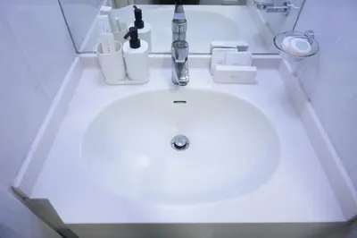 a sink in a bathroom with a white counter at Stylish Marina Stay Near Bla Bla club & JBR Walk in Dubai