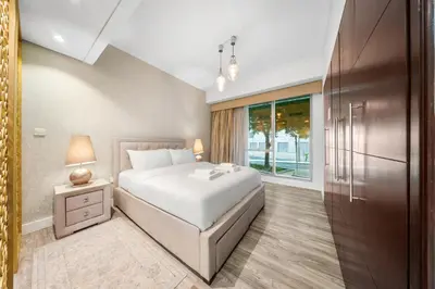 a bedroom with a white bed and a window at Prime Dubai Marina Spot - Beach, Dining and leisure in Dubai