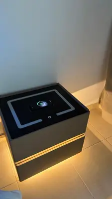 a black box with a light on the floor at Luxury Stay - Walk to Dubai Mall & Burj Khalifa 21 in Dubai