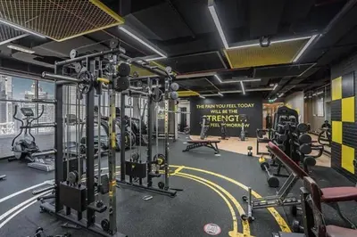 a gym with several treadmills and machines in a room at Luxury Stay - Walk to Dubai Mall & Burj Khalifa 21 in Dubai