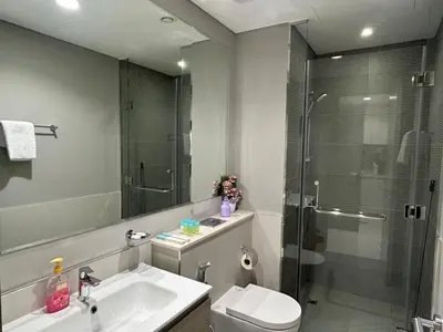 a bathroom with a toilet and a sink and a shower at Zada Tower, Business Bay in Dubai