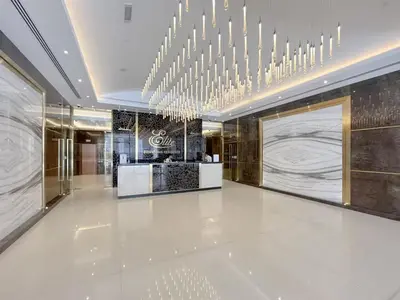 a lobby with a chandelier in a building at Front Burj View - 6min to Dubai Mall - Pool - Gym in Dubai