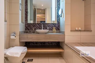 a bathroom with a sink and a toilet at Lux One Bedroom at Damac paramount in Dubai