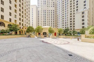 a courtyard in a city with tall buildings at JBR - spacious and neat 3br apt in Shams 1 in Dubai