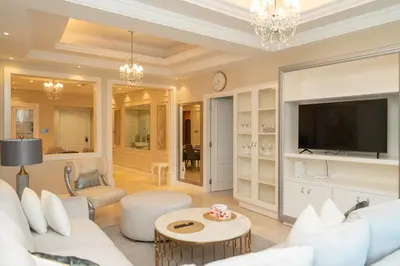 a living room with white furniture and a flat screen tv at BEACH FRONT I 2 Bedroom in TRIDENT JBR Dubai Marina I Palm & Sea Views I Amazing Balcony in Dubai