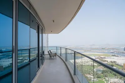 a balcony in a building with a view of the ocean at BEACH FRONT I 2 Bedroom in TRIDENT JBR Dubai Marina I Palm & Sea Views I Amazing Balcony in Dubai