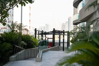 a walkway in the middle of a city with buildings at Luxury 2 Bedroom Apartment DAMAC Uppercrest Downtown Near Dubai Mall in Dubai