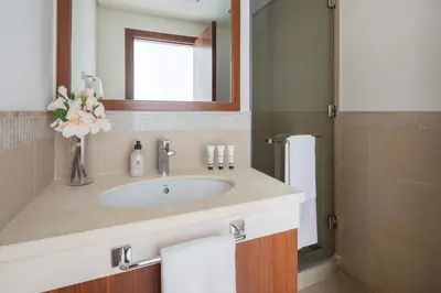 a bathroom with a sink and a mirror at Frank Porter - Burj Vista Tower 1 in Dubai