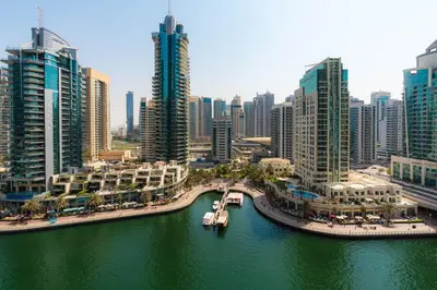 an aerial view of a city with a river and buildings at Scenic - Contemporary - Marina Getaway in Dubai