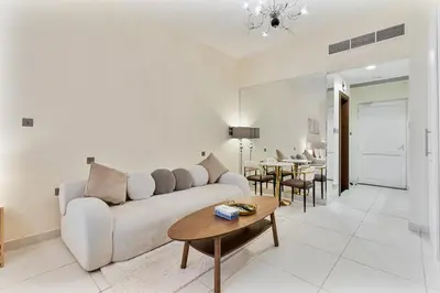 a living room with a couch and a table at Elegant Studio on Palm Jumeirah With Stunning Views in Dubai