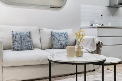 a living room with a couch and a table at Luxury 1BR in Sulafa Tower by EE Holiday Homes in Dubai