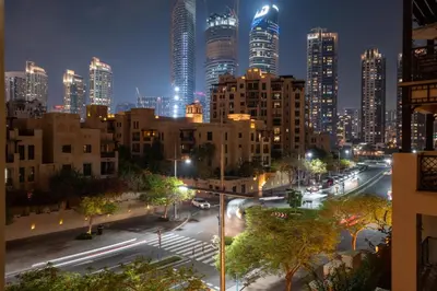 a view of a city at night with tall buildings at GuestReady - 2BR | Downtown Bliss with Burj View in Dubai