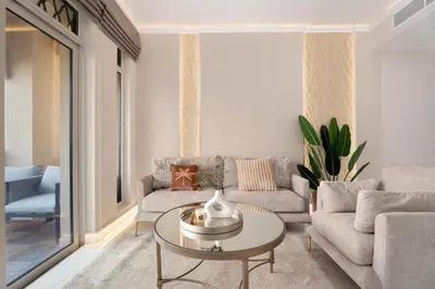 a living room with a couch and a table at GuestReady - 2BR | Downtown Bliss with Burj View in Dubai