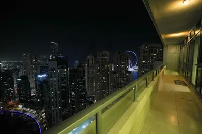 a view of a city at night from a building at Sparkle 205 in Dubai