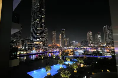 a view of a city at night with buildings at Sparkle 205 in Dubai
