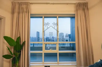 a window with a view of a city at Al Sahab 4202 in Dubai