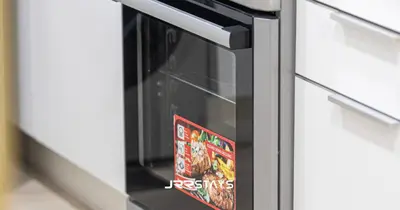a microwave oven with a book on it at Stylish Luxury 1BR - Modern Design - JVC in Dubai