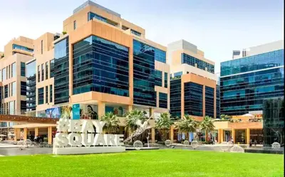 a large building with a sign in front of it at Vogue Business Bay - Bay Square close to Downtown Dubai Mall and Burj Khalifa, One Bedroom Apartment with Balcony and City view in Dubai