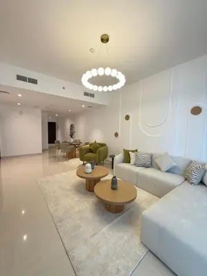 a large living room with couches and tables and a chandelier at Duja Tower 4404 in Dubai