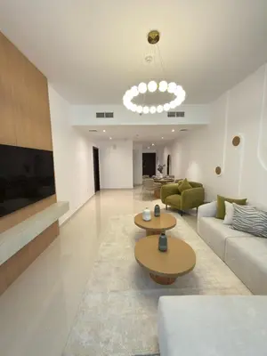 a living room with a couch and two tables in it at Duja Tower 4404 in Dubai