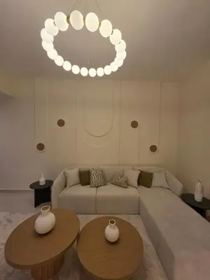 a living room with a couch and two tables at Duja Tower 4404 in Dubai