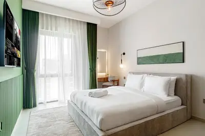 a bedroom with a bed and a large window at 833keys - 1BR - Lagoon Access - Vida Creek Beach - Creek Harbour - Dubai in Dubai
