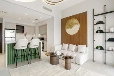 a living room with a couch and a table at 833keys - 1BR - Lagoon Access - Vida Creek Beach - Creek Harbour - Dubai in Dubai