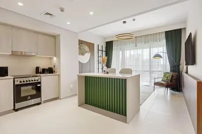 a kitchen with a green and white counter top at 833keys - 1BR - Lagoon Access - Vida Creek Beach - Creek Harbour - Dubai in Dubai