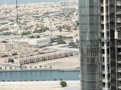 a view of a city with a building and a river at Exquisite 2BR With Balcony in Business bay in Dubai
