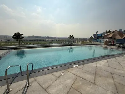 a large swimming pool on top of a building at Luxury 2BR - Nobles Tower - Business Bay in Dubai